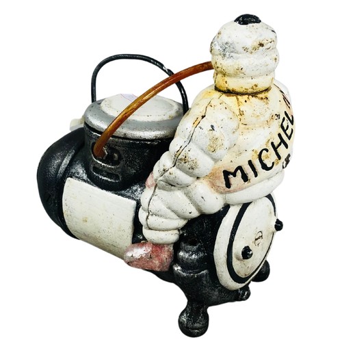 463 - Cast Iron Michelin Man Sat on a Bomb Dispenser.