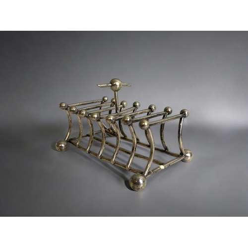 263 - A collection of three 19th century silver plate toast racks. Christopher Dresser style designs. Incl... 