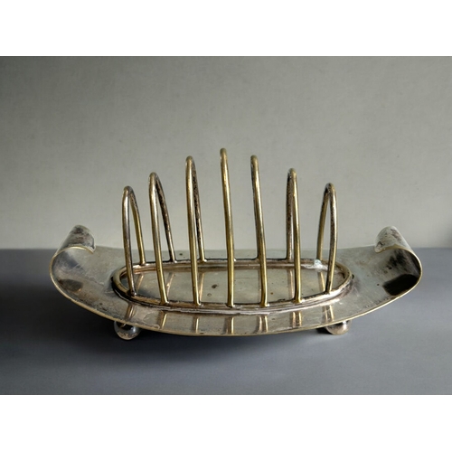 264 - A collection of four 19th century silver plate toast racks. Christopher Dresser style designs. Inclu... 