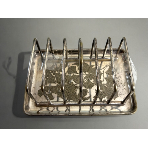 264 - A collection of four 19th century silver plate toast racks. Christopher Dresser style designs. Inclu... 