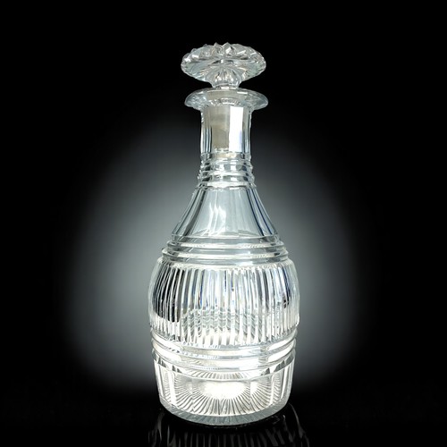 418 - A pair of Regency cut glass decanters. Height - 27cm