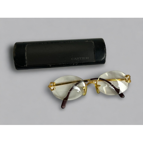 478 - A pair of Cartier Portofino eyeglasses.C 1990s, Gold framed. With original case.