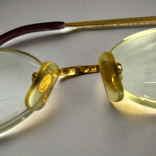 478 - A pair of Cartier Portofino eyeglasses.C 1990s, Gold framed. With original case.