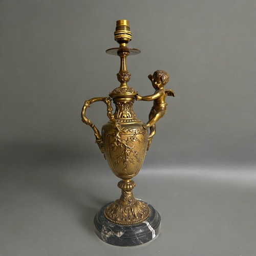 483 - A Vintage gilt metal 'Cherub' table lamp.In the Rococo style, with naturalistic design and mounted c... 