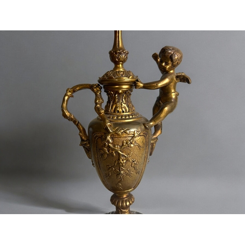 483 - A Vintage gilt metal 'Cherub' table lamp.In the Rococo style, with naturalistic design and mounted c... 