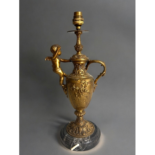 483 - A Vintage gilt metal 'Cherub' table lamp.In the Rococo style, with naturalistic design and mounted c... 