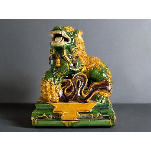 92 - A Chinese Sancai glazed Fo dog.Height - 35cmWidth - 30cm