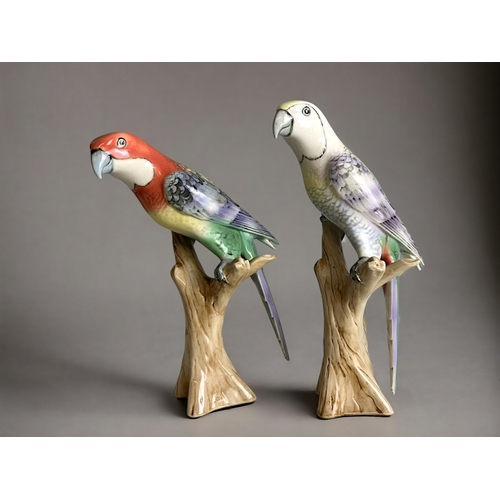 498 - Two Royal Dux porcelain parrots.Hand painted. Designed by V. Daniel. 27cm tall.