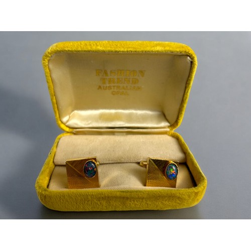 541 - A pair of men's gold plated & Australian Opal cufflinks. In original box.