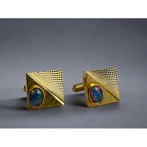 541 - A pair of men's gold plated & Australian Opal cufflinks. In original box.