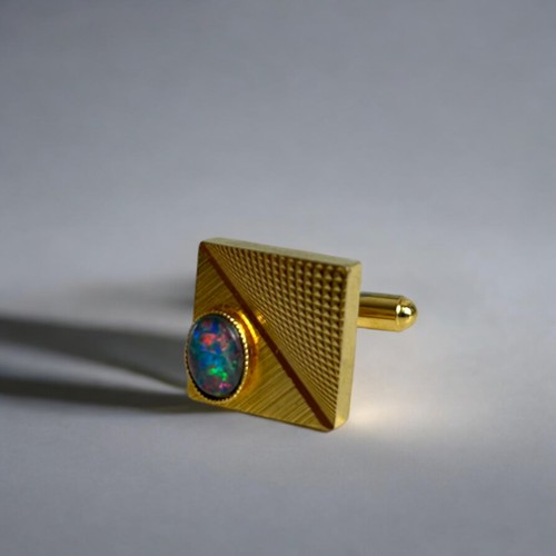 541 - A pair of men's gold plated & Australian Opal cufflinks. In original box.