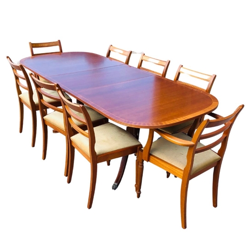 310 - A Large Extendable McIntosh Dining Room Table and 8 Chairs