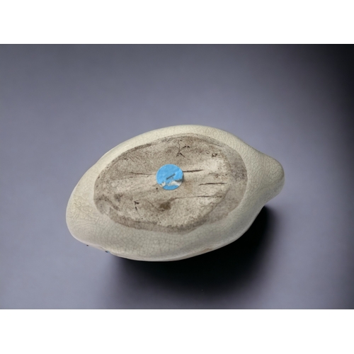 219 - A CHINESE PORCELAIN ZOOMORPHIC WATER DROPPER. Crackle ground, Modelled as a Goose on the water. 5 x ... 