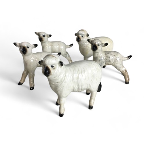 582 - Beswick Sheep and Lambs x 5, and a Sarreguemines Pottery Dolphin Gurgle Style vase.