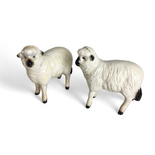 582 - Beswick Sheep and Lambs x 5, and a Sarreguemines Pottery Dolphin Gurgle Style vase.