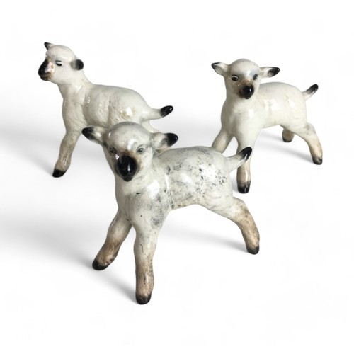 582 - Beswick Sheep and Lambs x 5, and a Sarreguemines Pottery Dolphin Gurgle Style vase.