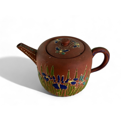 273 - A Japanese red clay teapot.Meiji period.Moriage painted foliate pattern.