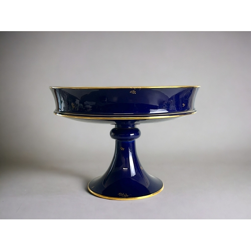 595 - A Sevres porcelain Centre piece / fruit bowl.20th century.Cobalt ground with gilt foliate sprigs and... 