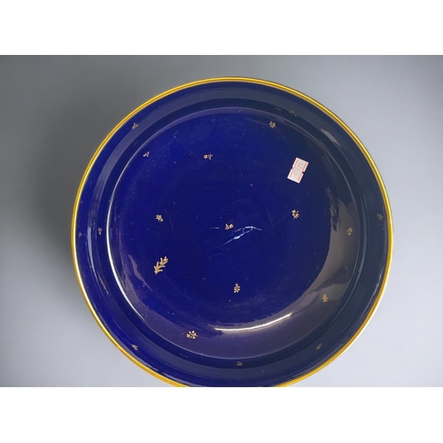 595 - A Sevres porcelain Centre piece / fruit bowl.20th century.Cobalt ground with gilt foliate sprigs and... 