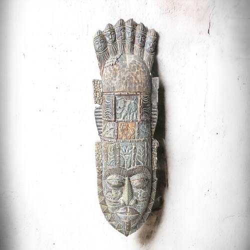 604 - A large hand carved wooden African mask.Formerly of the Shaka Zulu restaurant in London.Height - 102... 