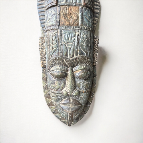 604 - A large hand carved wooden African mask.Formerly of the Shaka Zulu restaurant in London.Height - 102... 