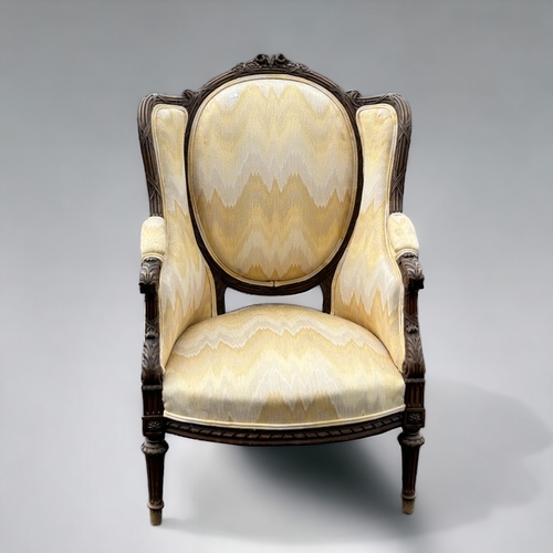 612 - A Louis XVI upholstered carved walnut Bergère armchair.French, 19th century.Height - 107cm... 