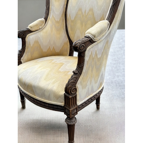 612 - A Louis XVI upholstered carved walnut Bergère armchair.French, 19th century.Height - 107cm... 