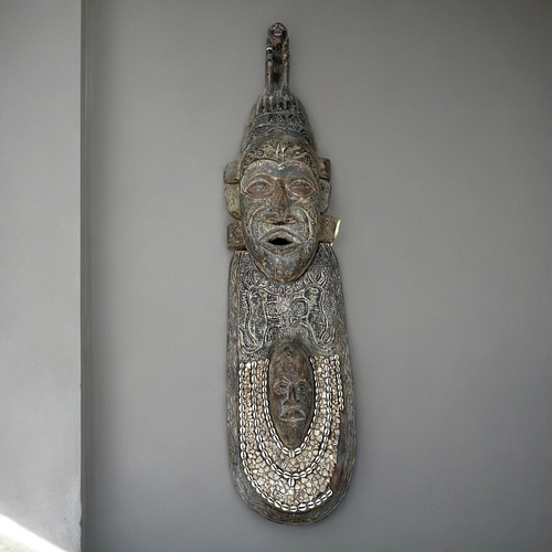 619 - A large two-piece African carved Teak wall mask.Formerly of Shaka Zulu restaurant in London.Height -... 