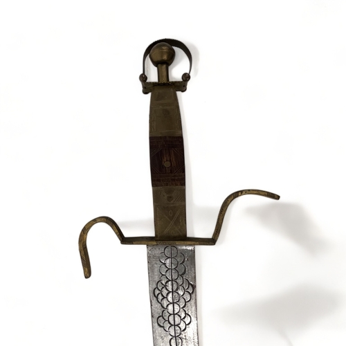 629 - A Taureg / Berber carved sword & Scabbard.
North Africa, 20th century.
Length - 110cm