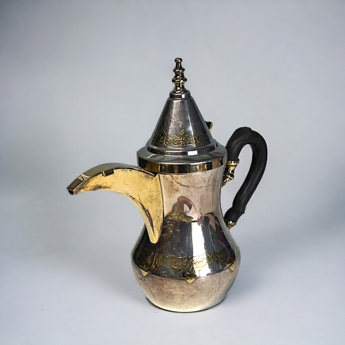 634 - A German 925 sterling silver coffee pot.'Dallah' form, with stylised parcel gilt motifs and spout. M... 