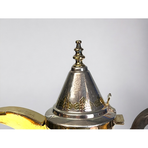 634 - A German 925 sterling silver coffee pot.'Dallah' form, with stylised parcel gilt motifs and spout. M... 