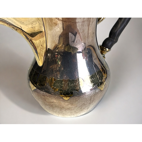 634 - A German 925 sterling silver coffee pot.'Dallah' form, with stylised parcel gilt motifs and spout. M... 