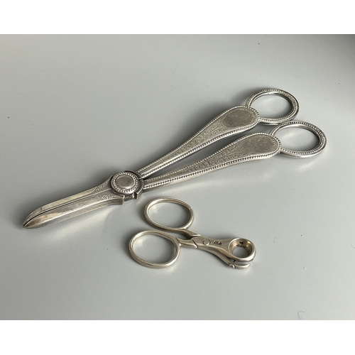 639 - A pair of sterling silver Cigar piercer. Together with a pair of silver plate Grape scissors.