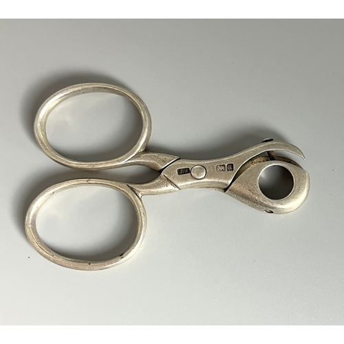 639 - A pair of sterling silver Cigar piercer. Together with a pair of silver plate Grape scissors.