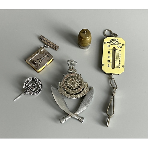 640 - A miscellaneous collection of Vertu. Including badge, brooches, Dice toton with bone dice, miniature... 