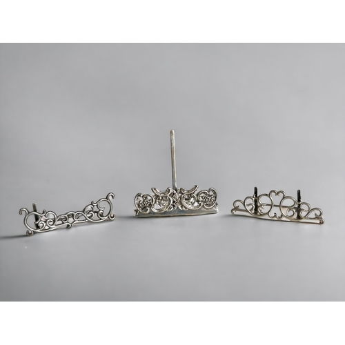 641 - Three antique sterling silver Menu holders.Larger with London, 1900 hallmarks and two Chester silver... 