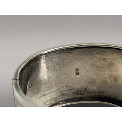 643 - A Victorian silver belt bangle.  By Jackson Brothers.Chester, 1886 hallmarks. 4 x 6.5cm.