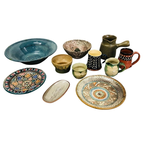 715 - Studio Pottery to include Mooresque charger, jugs etc