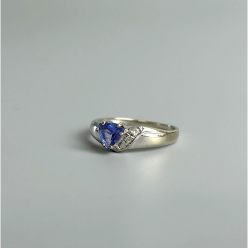 300A - A 9ct white gold, tanzanite and diamond ring. Approx Size N