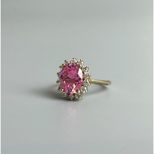 388A - A 9ct gold ring with large pink stone surrounded by clear stones.Approx size K