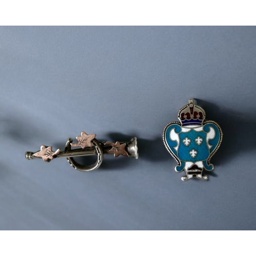 531 - Two antique sterling silver brooches. Includes an enamel  and Horse shoe examples.