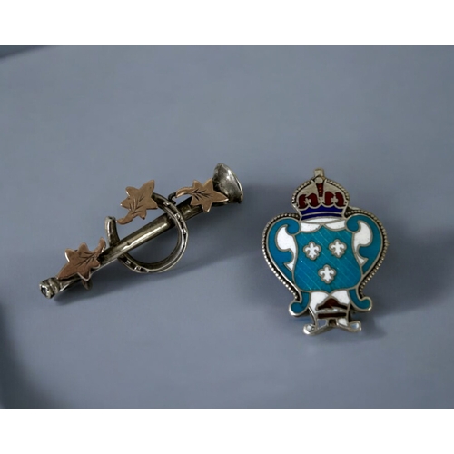 531 - Two antique sterling silver brooches. Includes an enamel  and Horse shoe examples.