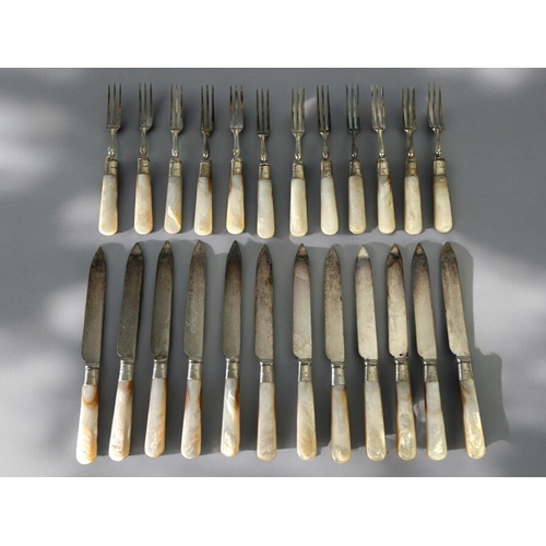 121 - A set of twelve silver collared knives & forks.With Mother-of-pearl handles. Sheffield hallmarks... 