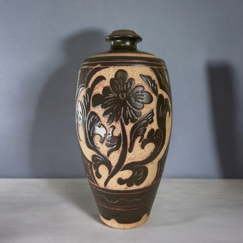 30 - A Chinese Cizhou type vase.Carved Peony blossom, with stylised foliate border design. Height - 31.5c... 