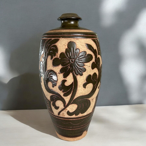 30 - A Chinese Cizhou type vase.Carved Peony blossom, with stylised foliate border design. Height - 31.5c... 