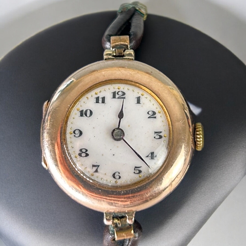 477 - A vintage 9ct Gold ladies Rolex wristwatch.White dial with black roman numerals.Case stamped Rolex, ... 