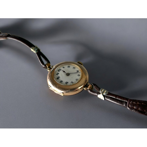 477 - A vintage 9ct Gold ladies Rolex wristwatch.White dial with black roman numerals.Case stamped Rolex, ... 