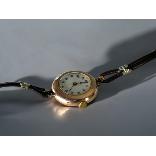 477 - A vintage 9ct Gold ladies Rolex wristwatch.White dial with black roman numerals.Case stamped Rolex, ... 