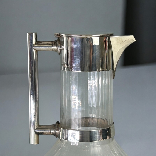 453 - Christopher Dresser (1834-1904) sterling silver mounted cut glass Claret jug.John Grinsell & son... 