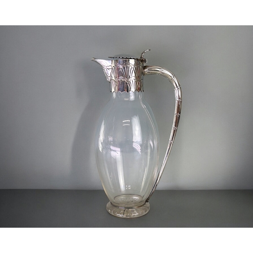 454 - Christopher Dresser style Edward Hutton silver mounted Claret jug.London, 1892 hallmarks.Stylised de... 